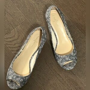 Cole Haan peep-toe wedge flats with a grey and white snakeskin pattern